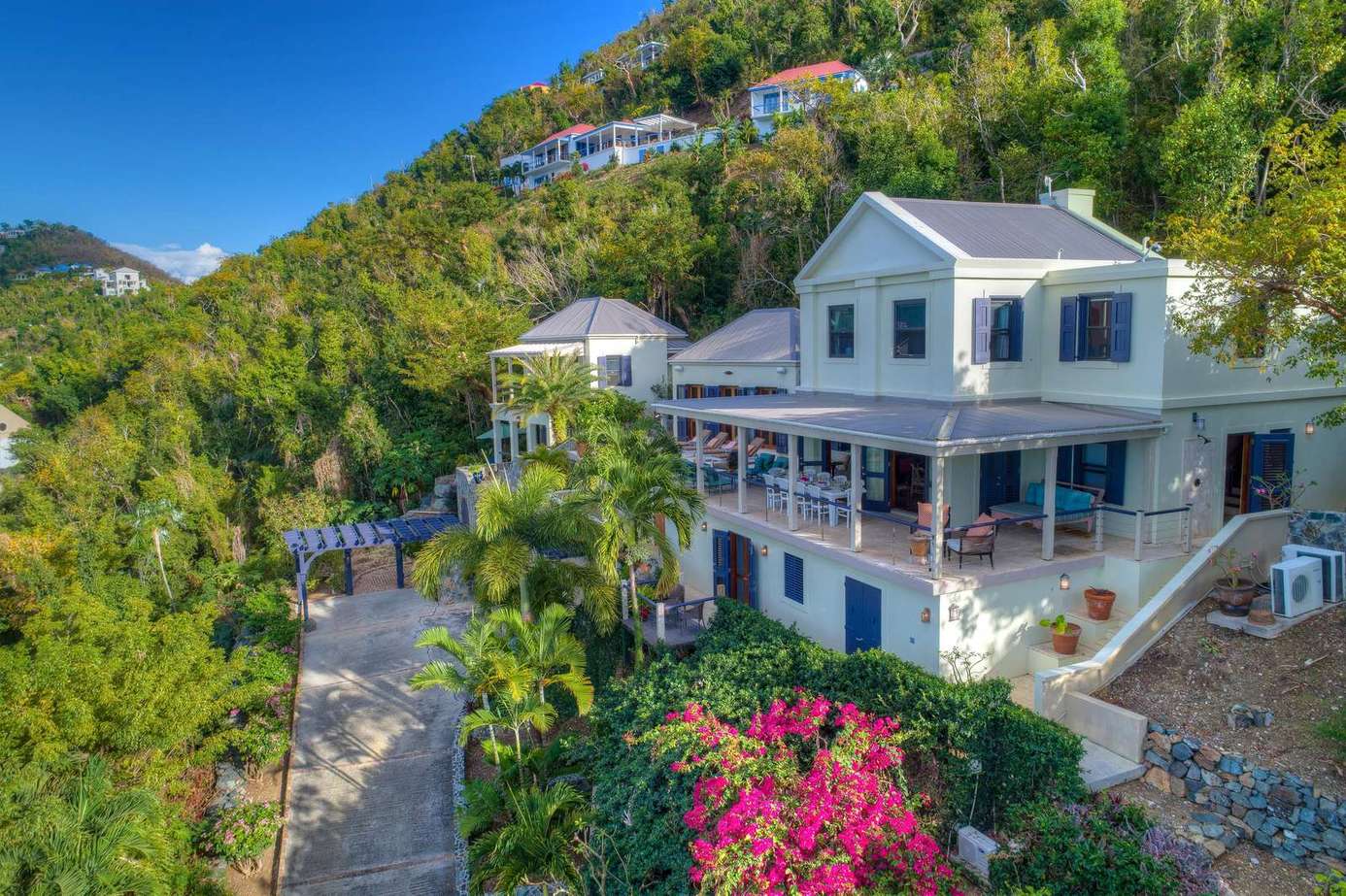 Spacious hillside retreat with panoramic mountain views and vibrant gardens