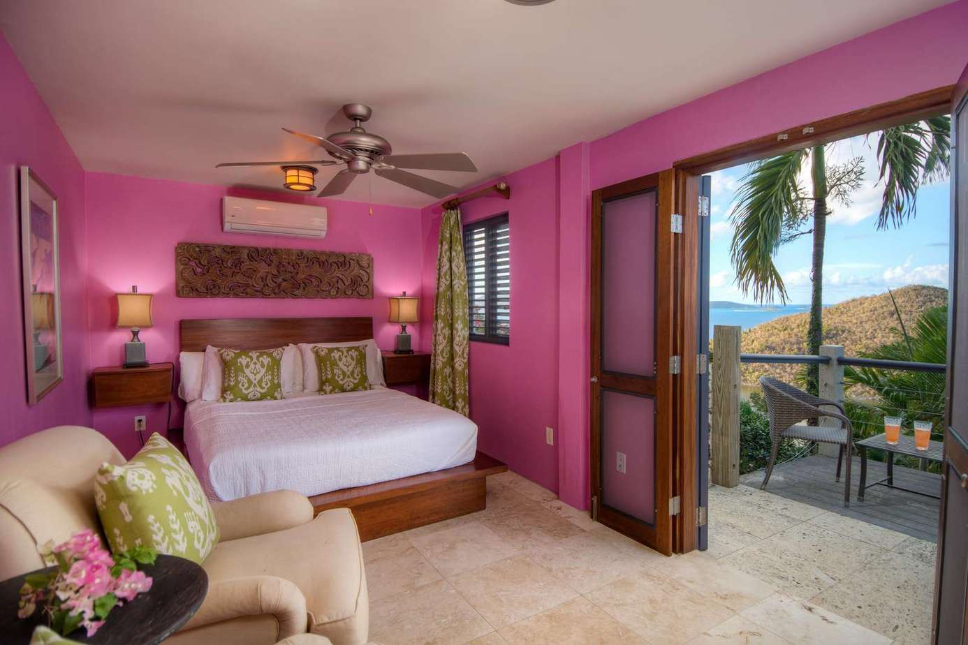Vibrant bedroom with tropical views and private balcony retreat