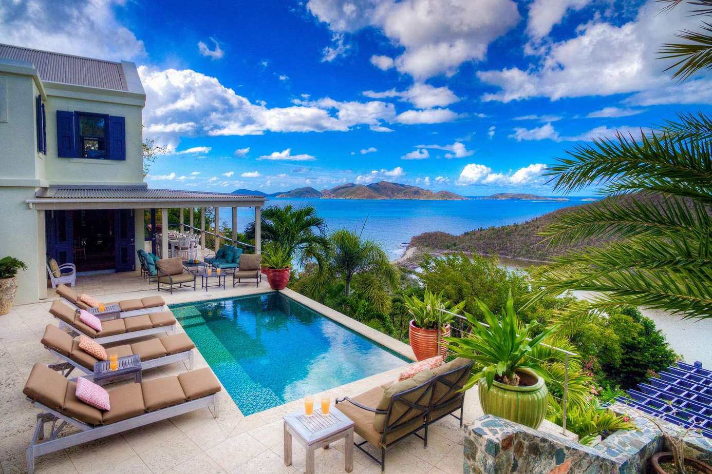 Sun-soaked patio with pool and stunning ocean views