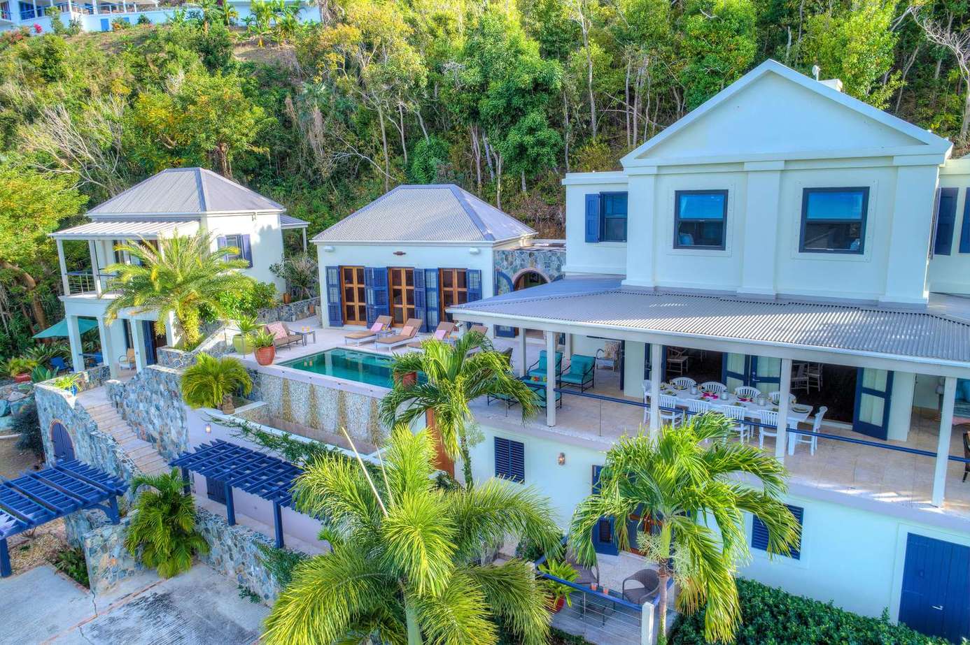 Spacious outdoor oasis with pool and tropical views