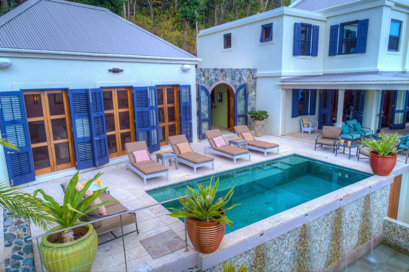 Sun-soaked patio with poolside loungers for ultimate relaxation