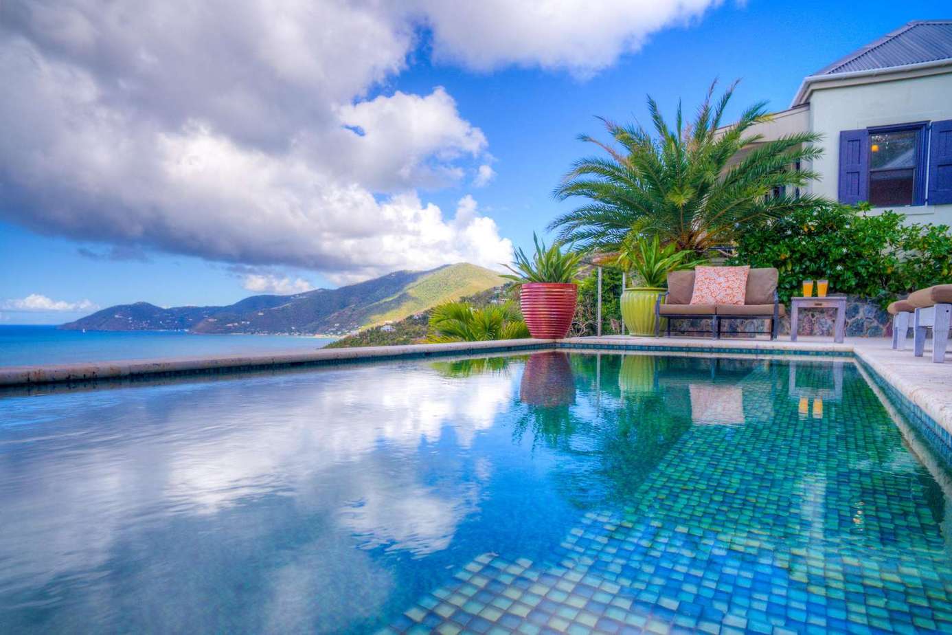 Oceanfront poolside retreat with stunning mountain views