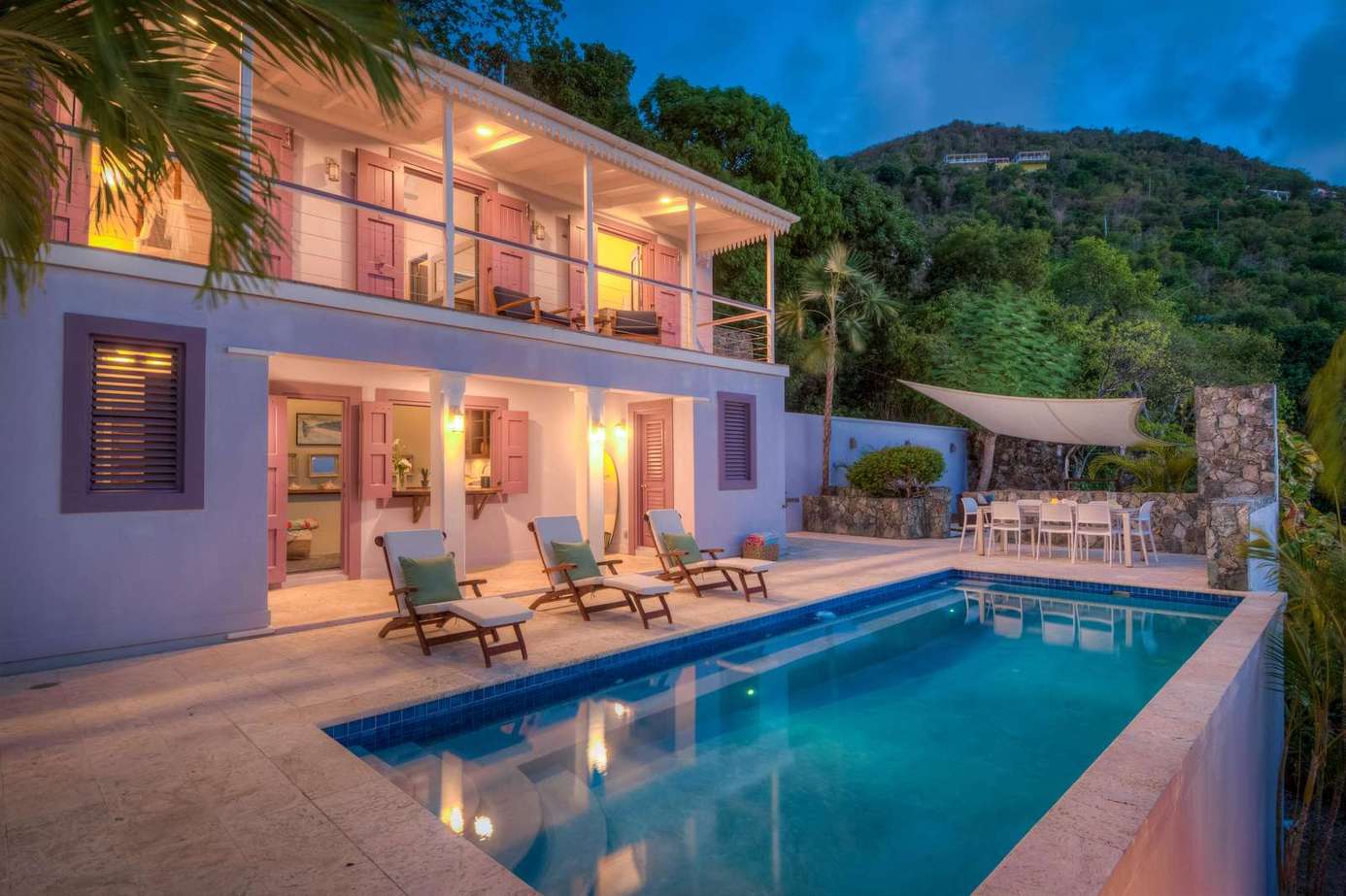 Sunlit patio with pool and mountain views for ultimate relaxation