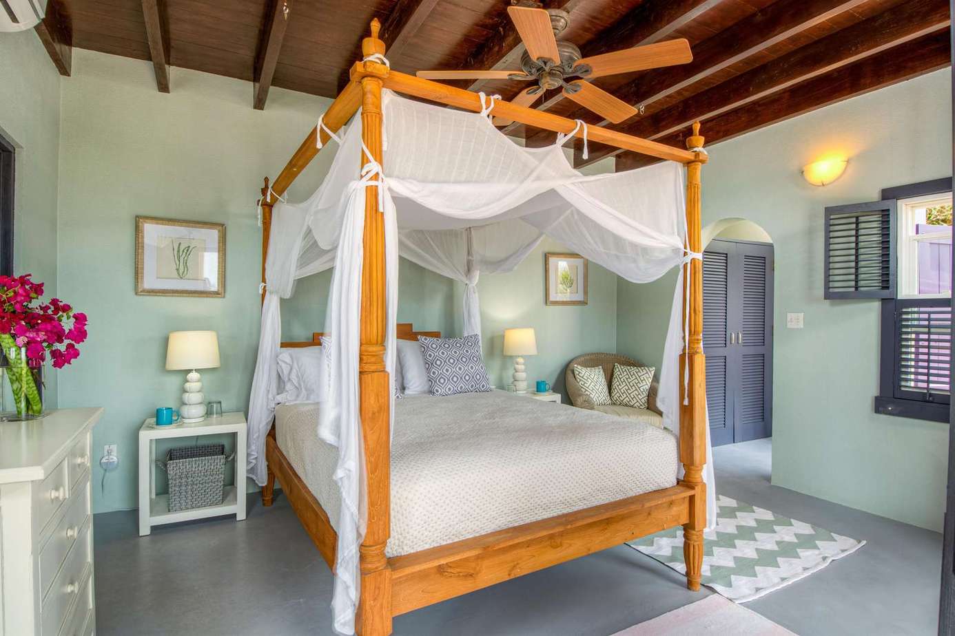 Charming bedroom with cozy four-poster bed and soft natural light