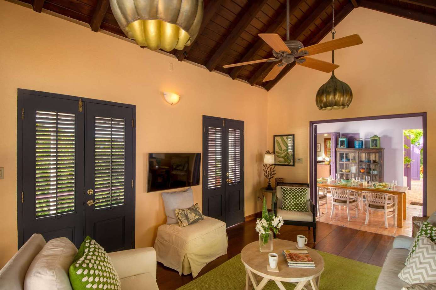 Cozy living room with vaulted ceilings and natural light