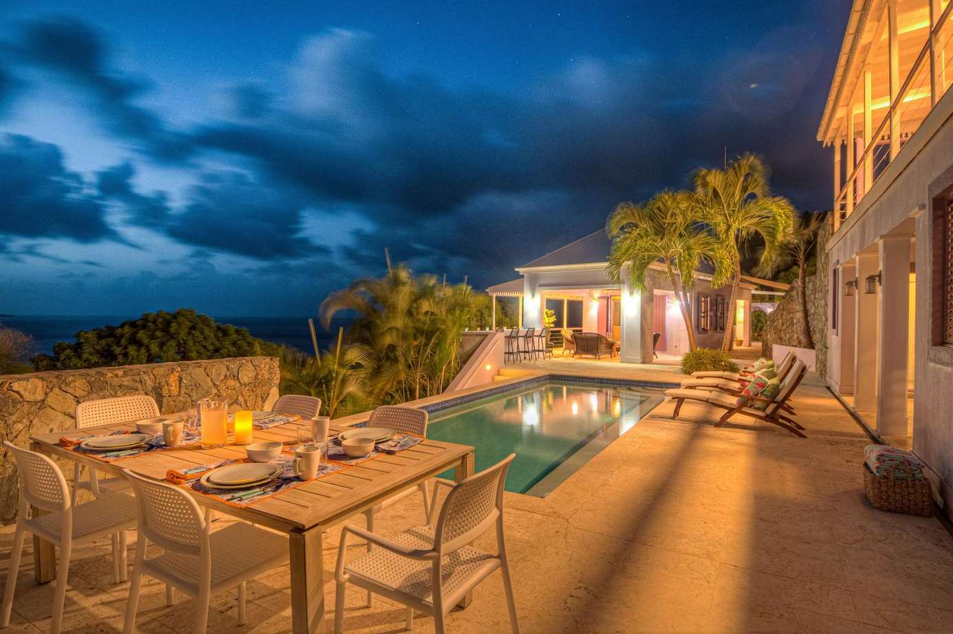 Starlit poolside dining and lounge area for unforgettable nights