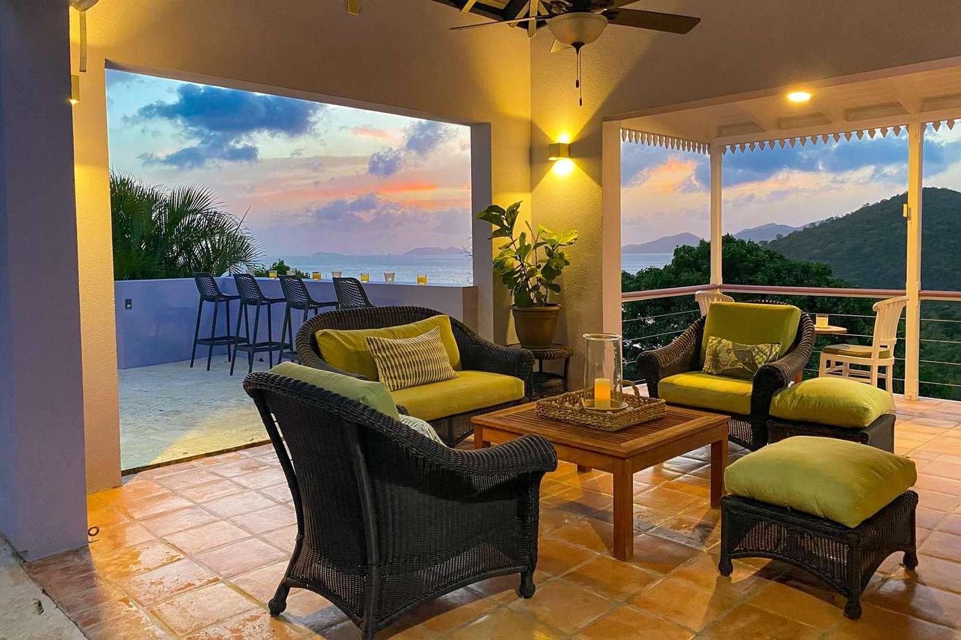 Cozy outdoor lounge with stunning sunset and mountain views