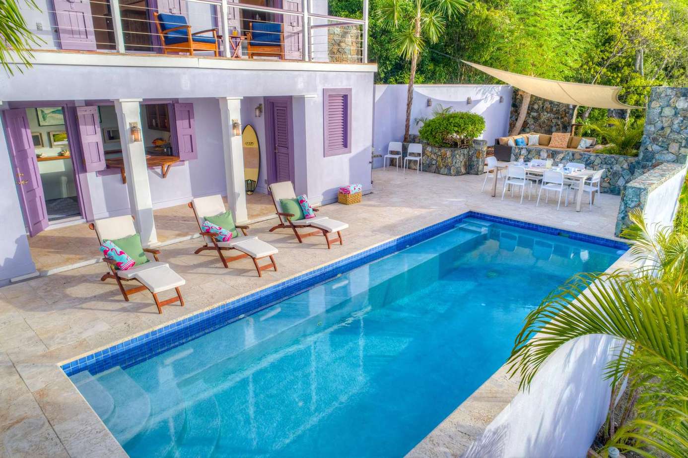 Private pool oasis with sun loungers and shaded dining area