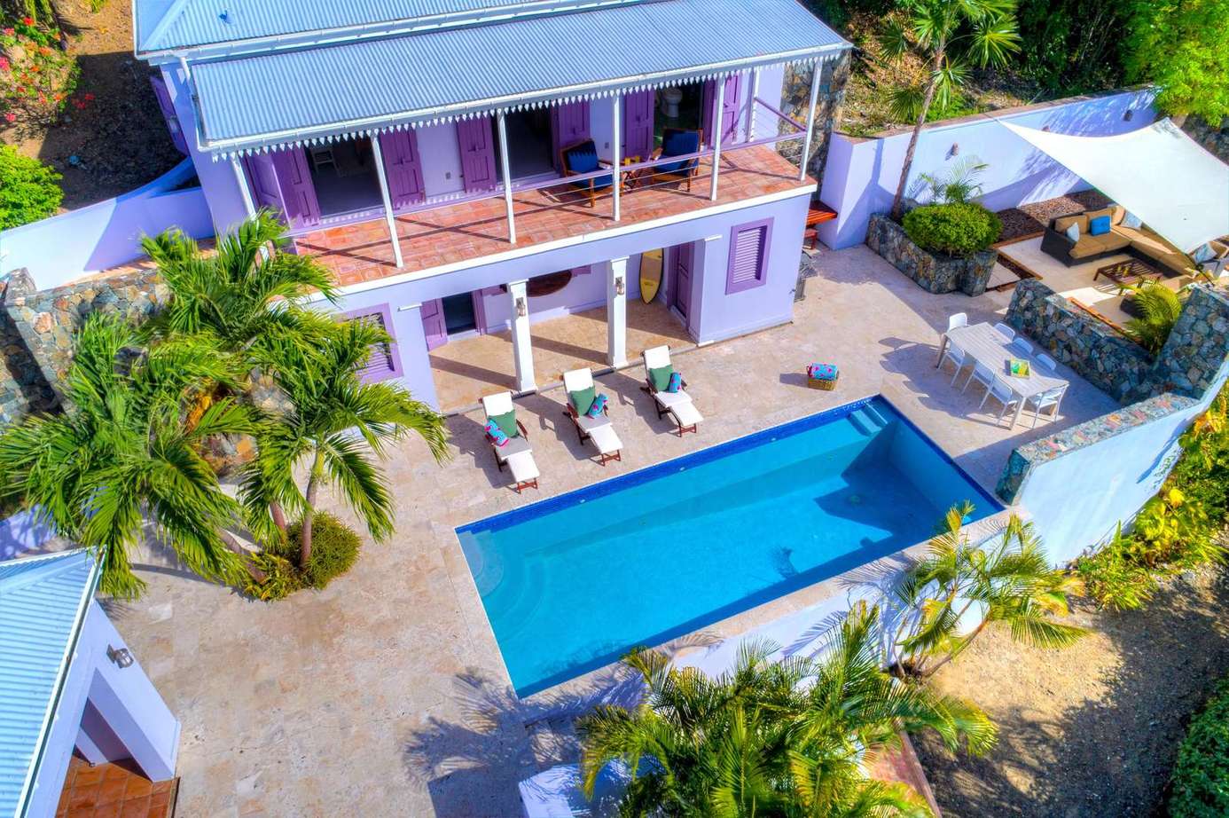 Spacious patio with pool and sun loungers for ultimate relaxation