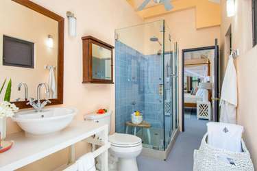 Bright, modern bathroom with spacious glass shower and elegant fixtures