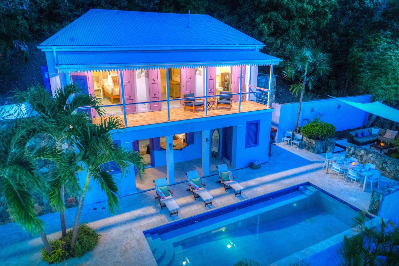 Modern two-story villa with poolside lounge and tropical vibes