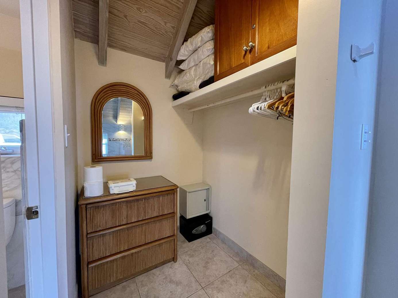 Cozy dressing area with ample storage and natural light