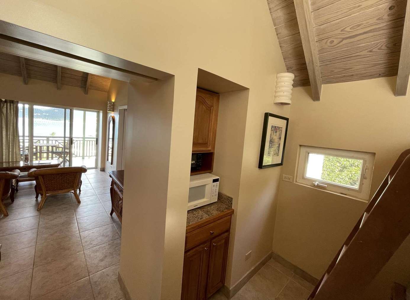 Cozy game room with pool table and natural light