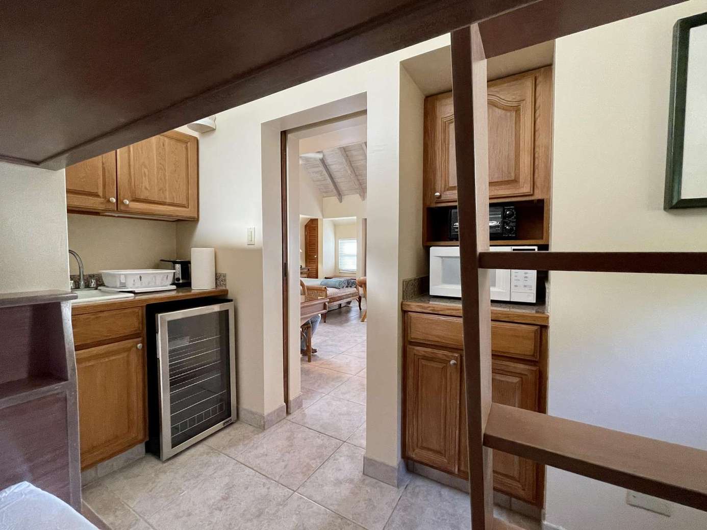 Cozy kitchenette with warm wood accents and natural light