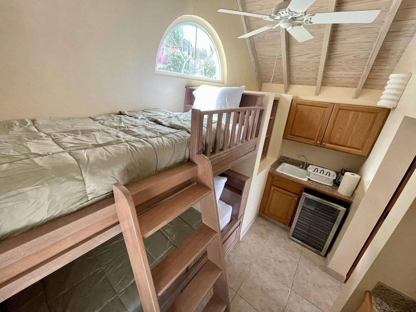 Cozy loft bunk beds with kitchenette for family comfort