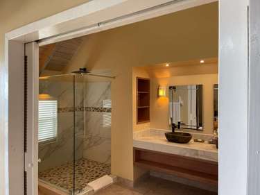 Spa-inspired bathroom with glass shower and modern vanity