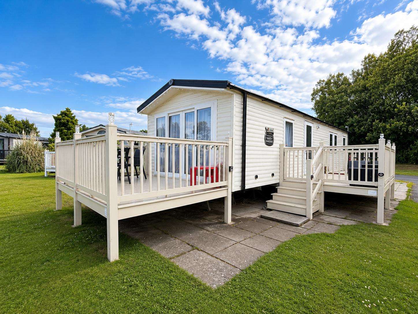 Escape to Southview Holiday Park Lincolnshire for a serene UK staycation, where you can enjoy peaceful mornings on the decking of a caravan with lake views, just a short trip from Fantasy Island Skegness. - property